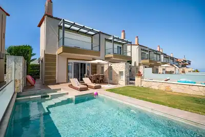 A stylish villa with private pool overlooking the Toroneos Gulf