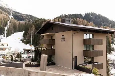 Image de Chambre 'Vista Suite 1, Alma Alpina Lodge' avec vue montagne, piscine commune et Wi-Fi