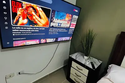 Image de Cozy, quiet and safe 5mnt from the airport the Americas $49 the evening