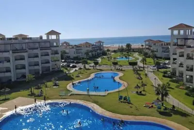 Image de Beachfront Apartment, Private Solarium, 4 Pools, Secure Residence, WiFi, Parking