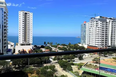 Image de Beachfront Luxury in Playa Salguero: Modern Condo with Ocean Breeze & Pool