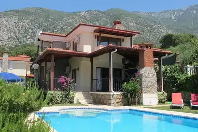 Image de Ax20, 3+1 villa to rent in Ovacık, has a unique location inside a pine forest.