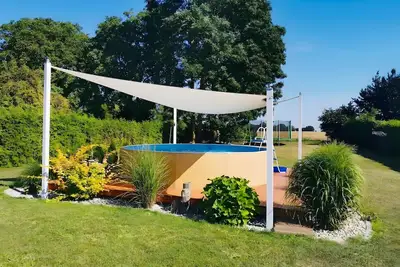 Image de Appartement « Maison de village idyllique près d’Usedom » avec piscine privée, terrasse et Wi-Fi