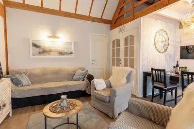 Image de Strandhuis with parking by Interhome