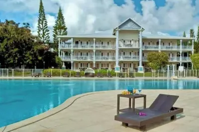 Image de Votre cocon tropical avec jardin – Appartement climatisé avec piscine