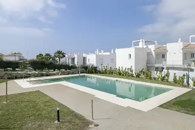 Image de Appartement « Moderno Atlanterra » avec piscine partagée