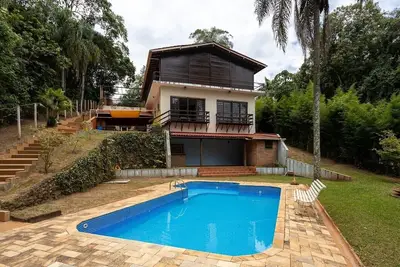Image de Casa com piscina, churrasqueira, Wi-Fi e garagem