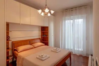 Image de GuestHost - Comfortable and spacious 58 squared meters apartment, perfect for four people, located on the sixth and top floor of a residential building with a lift (Not suitable for disabled guests). The property is located in a central and extremely conv