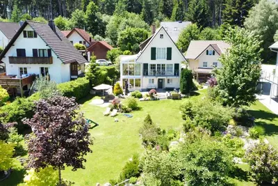 Image de Maison Wolfsgrund et Apt Wolfshöhle avec vue sur le lac, Wi-Fi et climatisation