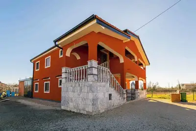 Image de Appartement de vacances avec jardin, barbecue et aire de jeux