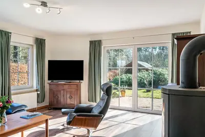 Image de Maison de vacances 'Friesenwald' avec terrasse privée, jardin commun et Wi-Fi