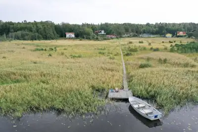 Seaside plot with private jetty, rowing boat & sunset