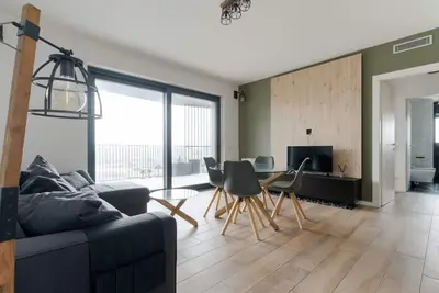 Image de Modern and welcoming 50 square meters apartment, perfect for four people, located on the eighth floor of a building with an elevator (Not accessible to disabled guests). The property is located in the Cascina Merlata neighborhood, a growing area on the ou