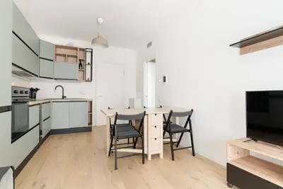Image de GuestHost - A comfortable and bright 55 square meters apartment, perfect for four people, located on the first floor of a building with an elevator (Not accessible to disabled guests). The property is located in the Cascina Merlata neighborhood, a growing