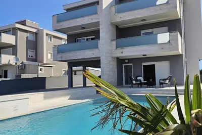 Image de Stylish Two-Bedroom Apartment with Spacious Sea-View Terrace & Shared Pool