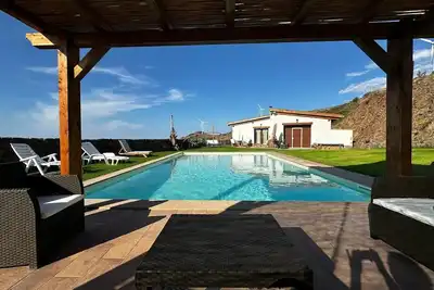 Image de Maison de vacances « I Fiori Del Vento » avec piscine privée, Wi-Fi et climatisation