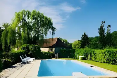Image de Maison de vacances « Moulin De La Forge » avec vue sur le lac, piscine privée et Wi-Fi