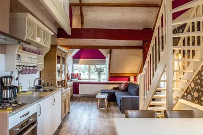 Image de Enjoy luxury and private wellness in an attractive apartment with authentic farmhouse elements. Perfect for a relaxing vacation with friends, family or your partner. With a view of nature and luxury facilities such as a steam cabin and whirlpool bath