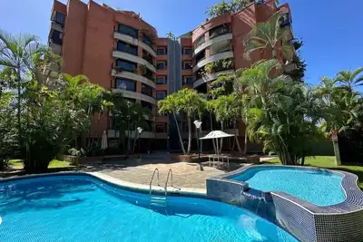 Image de Spacious 4-bedroom apartment in serene Caracas with Ac and pool