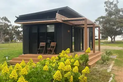 Image de The Pink Lake Tiny House - 'Dandelion' - deluxe tiny house with pink lake views.