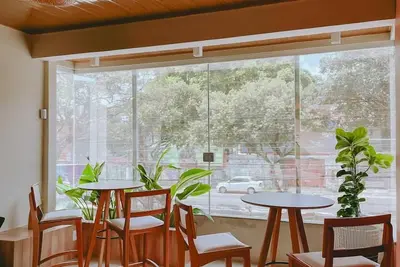 Image de 5 minutes from the Hangar. Fully equipped guesthouse: kitchen, living room and balcony, all air-conditioned.