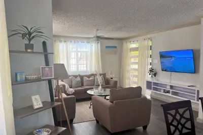 Image de 4-bedroom 2 Bathroom house with Ac offers a blend of comfort and tranquility.