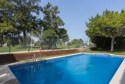 Image de Maison de vacances « Adosado Oliva Nova » avec piscines partagées, terrasses et Wi-Fi