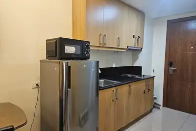 Image de Cozy Pool View 1 bedroom condo in Charming Manila with Ac near Sm Mall of Asia