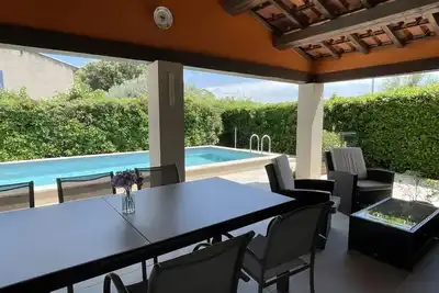 Image de Maison d’hôtes « Chambre d’hôte » avec terrasse partagée, jardin partagé et climatisation