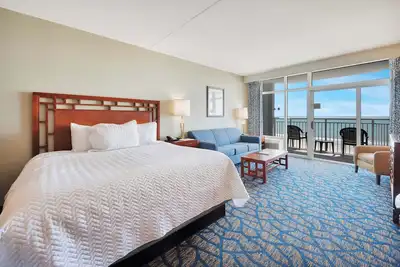 Amazing Beachfront condo with pools, gym & balcony