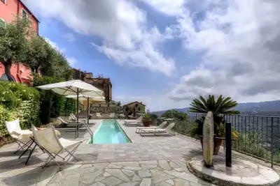 Image de Cozy apartment \"La Piazzetta\"  in a building with a garden and swimming pool.
