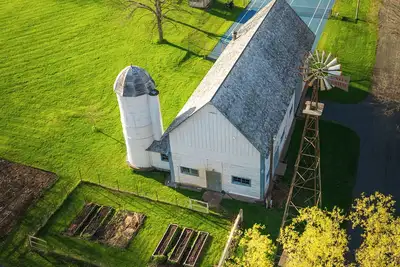 Image de Welcome to Unity Farm; Three private cottages set across restored prairie and forest along the St. Croix River, with a barn and tennis courts. Designed for group retreats and family gatherings, with trails, open space, and room to slow down.