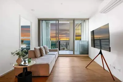 High-Floor Docklands Apartment with Pool & Parking