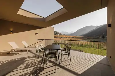Image de Appartement Trianglhof 'Rosengarten' avec vue sur les montagnes et terrasse rooftop