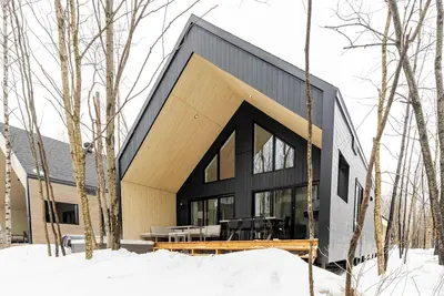 Image de ØM de Portneuf  Spa prive  Chalet moderne  Nature