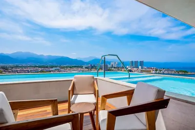 Image de Resort condo with balcony, scenic view, rooftop pool, & well-equipped kitchen