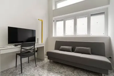 Image de GuestHost - Cozy flat of approximately 60sqm, ideal for 3, located on the ground floor of a building. The accommodation is located in the Greco area, characterized by a historic atmosphere, with the Church of San Martino and the Naviglio della Martesana a