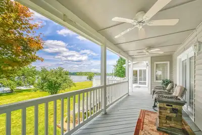 Image de Lakefront retreat with a large yard, stone fire pit, gazebo, deck, & dock