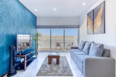 Luxury condo with shared gym, rooftop pool, and centrally located