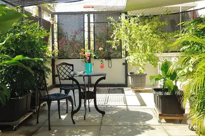 Image de Enjoy your private tropical terrace by the Condado lagoon.