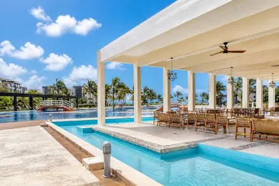 Elegant condo with beach access, balcony views.