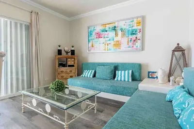 Beachfront Condo with Pool, Balcony & WiFi