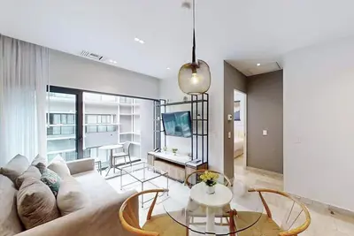 Charming oceanfront apartment with private balcony, pool & stunning sunset views