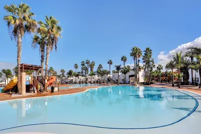 Image de Appartement de vacances « Oasis Duna_Sun Fun Pool » avec piscine partagée, terrasse privée et Wi-Fi