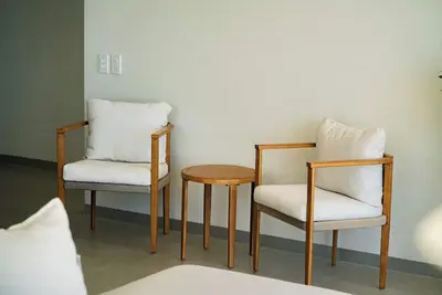 Image de Welcome to Sun & Salt, an oceanfront condominium in El Zonte's Surf City featuring two bedrooms, two and a half bathrooms, a resort-style pool, and space for up to four guests.