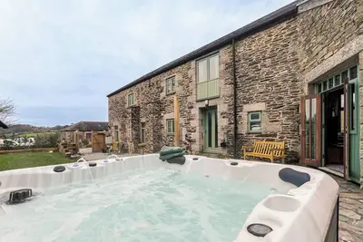Image de Superbe grange côtière avec bain à remous
