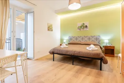 Image de Chambre « Donna Letizia - Quadruple » avec balcon, Wi-Fi et climatisation