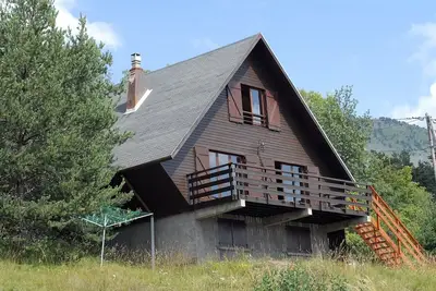 Image de Chalet avec vue sur les montagnes, jardin privé et balcon