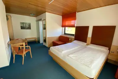 Image de Family room with balcony - Gästehaus Brütting