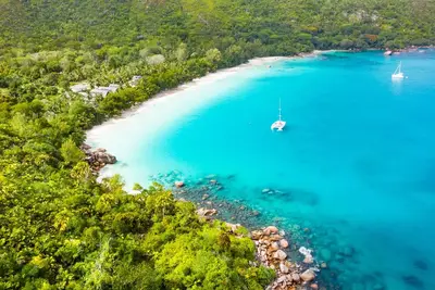 Seychelles Sun-Soaked Sailing: A Pristine Beach Experience from Praslin